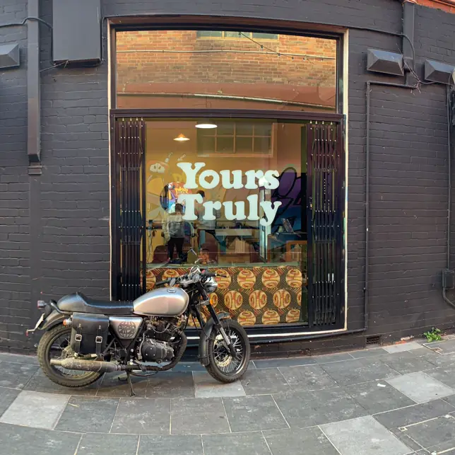 Shopfront with a motorbike parked outside